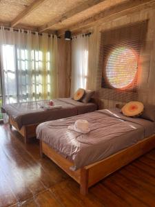 Ένα ή περισσότερα κρεβάτια σε δωμάτιο στο Baan pakdee