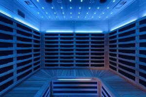 a room with a large closet with blue lighting at Big Family Home Near Romo Spacious for 30 Guests in Skærbæk