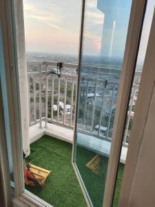 a view from the balcony of a building at Tanglin Tower with Netfix by AquHome in Surabaya