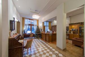 a living room with a christmas tree in the center at Capsis Bristol Boutique Hotel in Thessaloniki