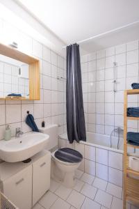 Et badeværelse på Relax & Stay Apartment