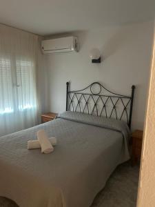 Ένα ή περισσότερα κρεβάτια σε δωμάτιο στο El Flamenco