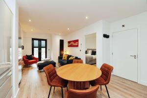 a living room with a table and a couch at Solihull Modern Living - 1 Bed Apartment in Solihull
