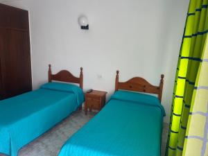 Ένα ή περισσότερα κρεβάτια σε δωμάτιο στο El Flamenco