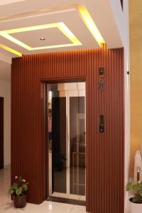 a wooden wall next to a door in a building at Masbah residency in Jāmb