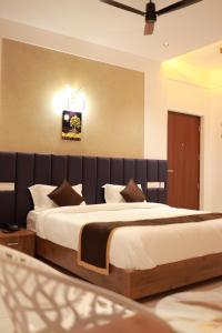 a bedroom with a large bed in a room at Masbah residency in Jāmb