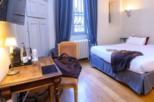 En eller flere senge i et værelse på Résidence Charles Quint