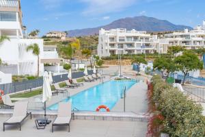 Πισίνα στο ή κοντά στο Acogedor y céntrico apartamento en Estepona