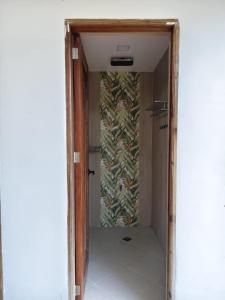 a hallway leading to a room with a wall at J's PALM BEACH Resort in Batangas City +6 photos