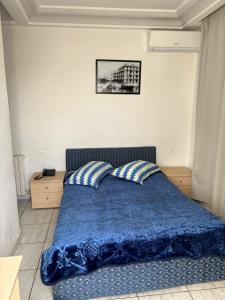 Giường trong phòng chung tại Hotel Amine +29 ảnh