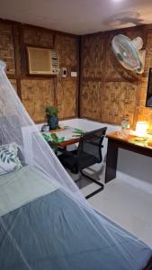 a room with a table with a net on it at Nipaville Haven in Moalboal +11 photos