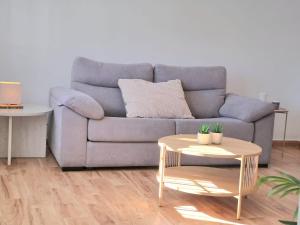 a living room with a couch and a table at Noctua 012 Estepona Oldtown 3 in Estepona