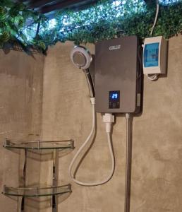 a hair dryer is attached to a wall at Nipaville Haven in Moalboal