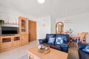 a living room with a couch and a tv at Acag 135 in Orihuela