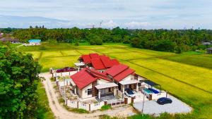an aerial view of a house with red roofs at AS Suria Homestay Banglo 1 Tingkat Kota Bharu in Kota Bharu