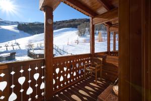 a porch with a view of a ski slope at Mono 1400 in Limone Piemonte +13 photos