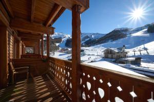 a balcony with a view of a snow covered mountain at Mono 1400 in Limone Piemonte