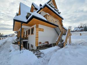 Το Apartament Koliba by Domki Tatry τον χειμώνα