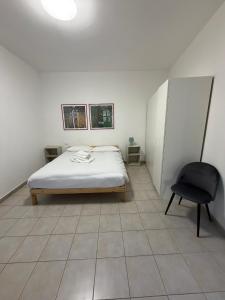 Ένα ή περισσότερα κρεβάτια σε δωμάτιο στο Giuditta Room