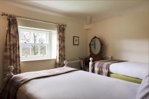 Postel nebo postele na pokoji v ubytování Stank House Farm Bolton Abbey