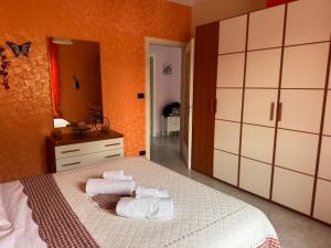 Postel nebo postele na pokoji v ubytování GuestHost - Sinergie Creative Home