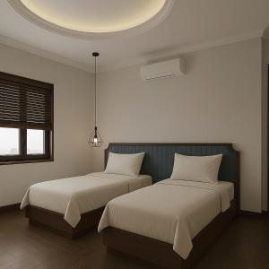 Giường trong phòng chung tại Maya Central Hotel & Spa