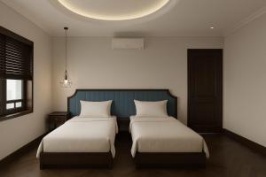 Giường trong phòng chung tại Maya Central Hotel & Spa