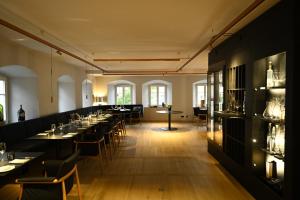 a large dining room with tables and chairs at Das Hotel by Ferber in Monheim +9 photos