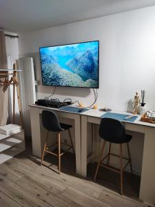 TV/trung tâm giải trí tại Royal blue studio Offrez-vous le confort