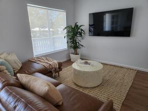 a living room with a couch and a coffee table at Beach Bound-Jervis Bay in Vincentia