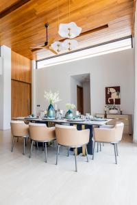 a dining room with a table and chairs at Botanica Foresta B10 in Phuket
