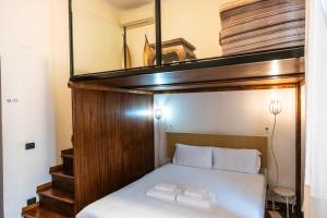 a bunk bed with two towels on top of it at La Vite 94 in Rome +39 photos