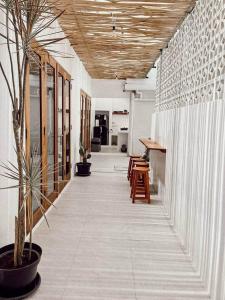 a hallway of an office with a table and chairs at Chic 2BR Villa w/Rock Plunge Pool in Denpasar