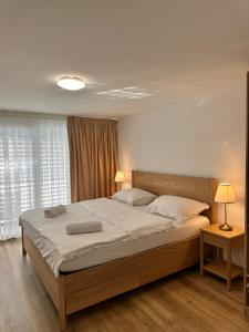 Ένα ή περισσότερα κρεβάτια σε δωμάτιο στο The Golf apartments