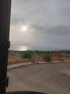 a view of the ocean from a bus at Maison de repo in Mostaganem