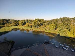 a view of a river with a boat in it at Copthorne Hotel Cardiff-Caerdydd in Cardiff
