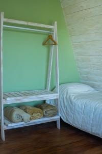 En eller flere senge i et værelse på Brisas del Ceferino