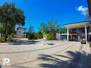a parking lot in front of a building at Tabbowa Lake Resort in Puttalam