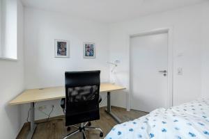 Ένα ή περισσότερα κρεβάτια σε δωμάτιο στο Südstadt Appartment