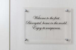 a sign with welcome to the first biological home in the world at Wellness Villa Biocrystal in Bakarac
