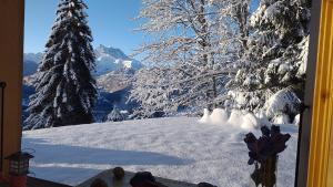 a group of people standing on a snow covered mountain at apartment with big garden and stunning view Chesieres in Villars-sur-Ollon +1 photo