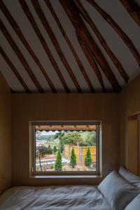 a bedroom with a window with a view at 고요별서 goyobyeolseo 