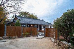 a house with a fence in front of it at 고요별서 goyobyeolseo 