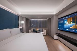 Μια τηλεόραση ή/και κέντρο ψυχαγωγίας στο Beijing Guomao Jianguomen Manxin Hotel