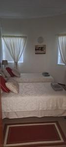 Ένα ή περισσότερα κρεβάτια σε δωμάτιο στο Outeniqua Strandwoonstel