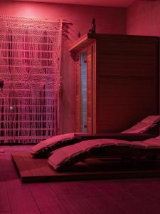 a bedroom with two beds and a red wall at Villa Margares in Valenzano +61 photos