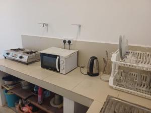 Η κουζίνα ή μικρή κουζίνα στο villa Calm Haven +43 φωτογραφίες