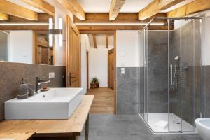 a bathroom with a sink and a shower at Alpin Chalet Samer Apt Fürstenblick in Sarntal +37 photos