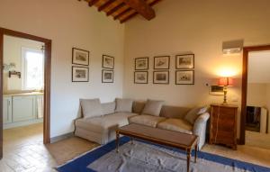 a living room with a couch and a table at Beautiful Home In Ansedonia in Ansedónia