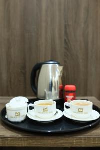 Příslušenství pro přípravu čaje a kávy v ubytování Majestic BnB